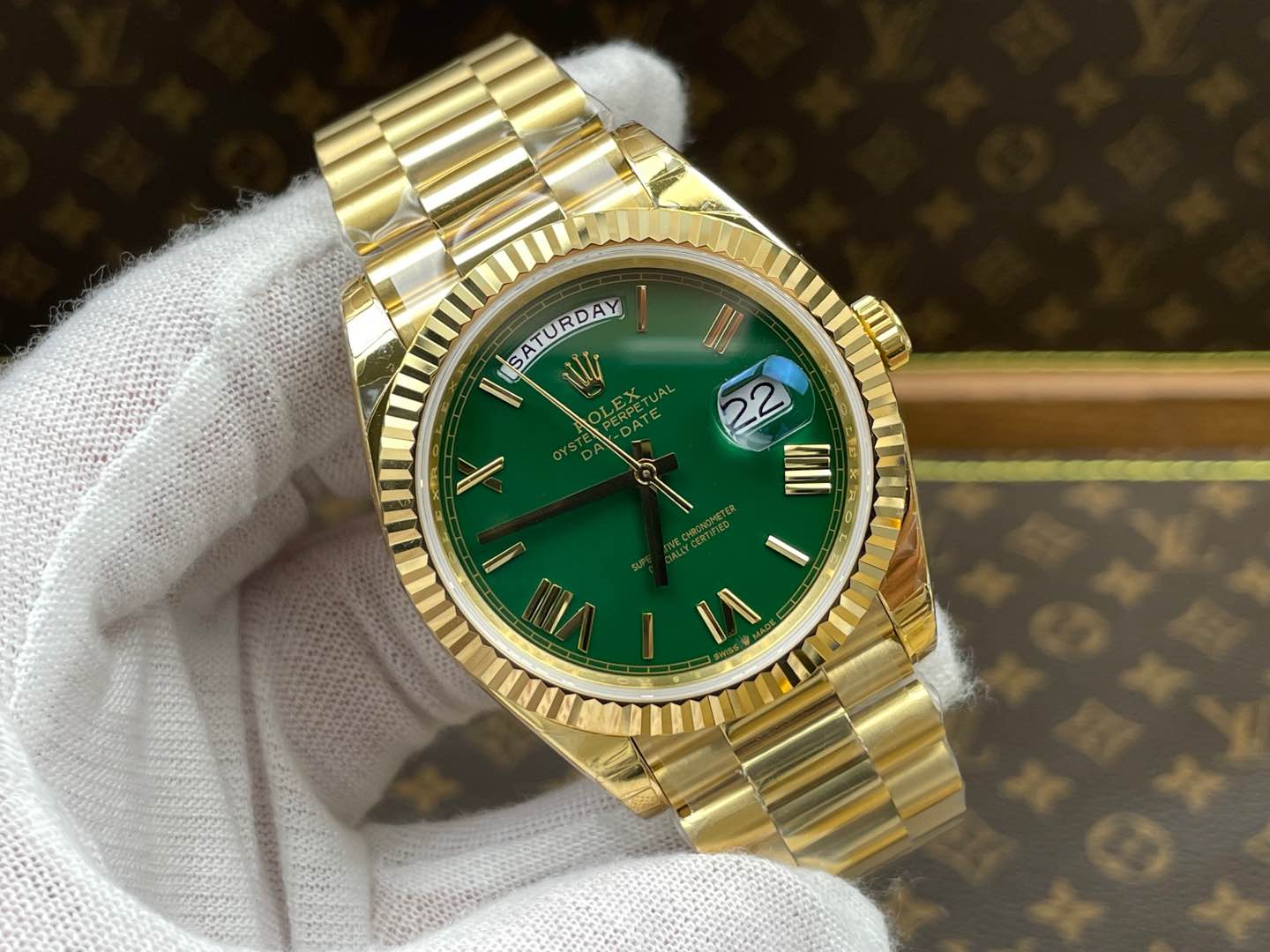 Rolex Day-Date 40, yellow gold, green dial