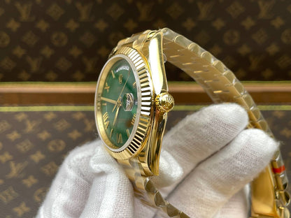 Rolex Day-Date 40, yellow gold, green dial