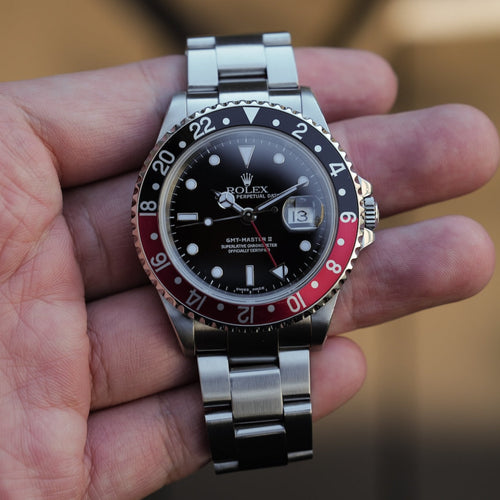 Rolex GMT-Master II, red & black bezel (“Coke” style)