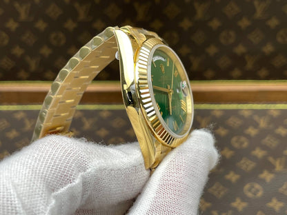 Rolex Day-Date 40, yellow gold, green dial