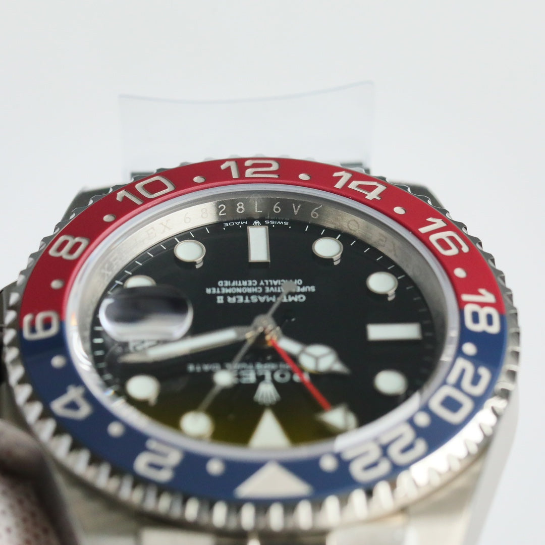 Rolex GMT-Master II, red & black bezel (“Coke” style)